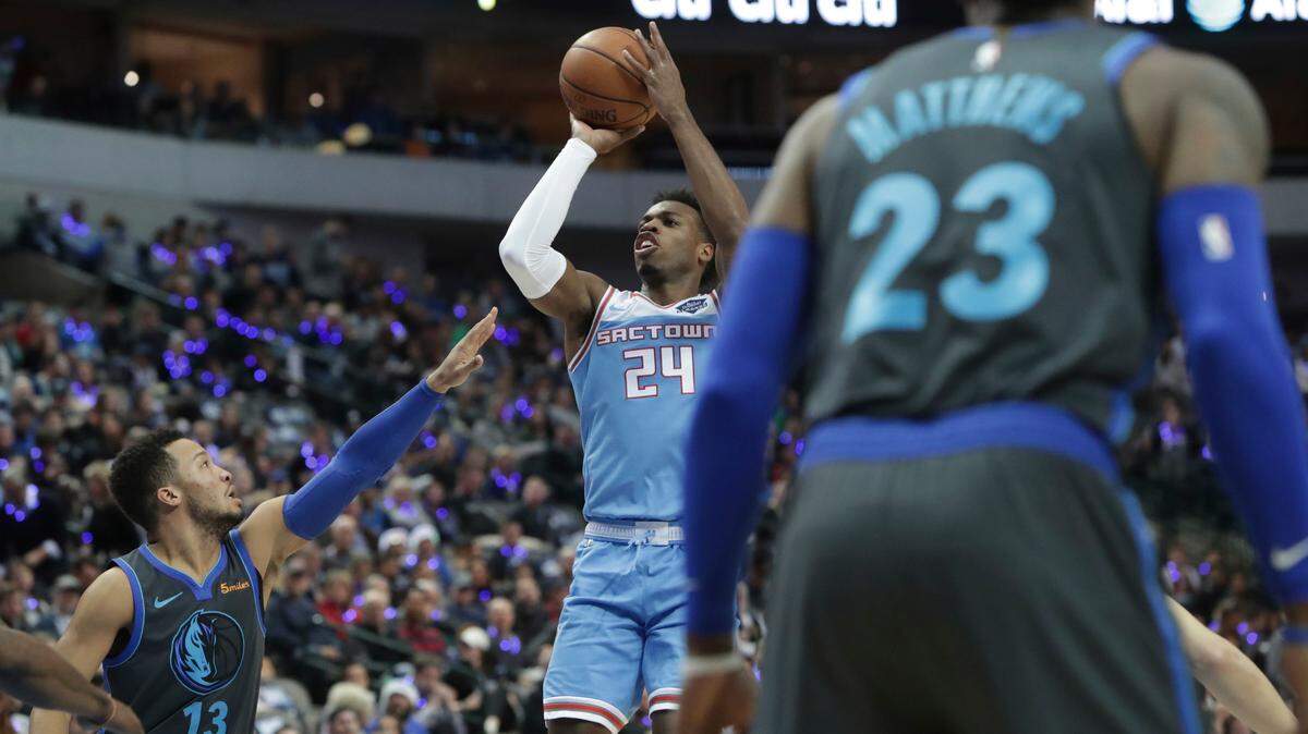 Kings guard Buddy Hield shoots against the Dallas Mavericks on Sunday in Dallas. Hield scored a game-high-tying 28 points to help Sacramento win 120-113.