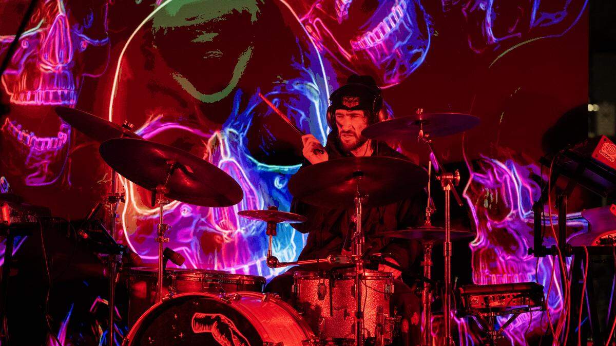 Jacob Swedlow, drummer for the Sacramento-based group the LabRats, performs on Front Street in Old Sacramento before the New Year's fireworks on Wednesday, Dec. 31, 2025.