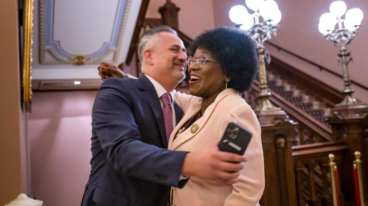 Assemblywoman Tina McKinnor, D-Inglewood, right, is embraced by Cesar Diaz, a state Senate staffer, after McKinnon leaves Senate chambers following the passage of Assembly Bill 1, allowing legislative employees the right to unionize, last month at the state Capitol in Sacramento.