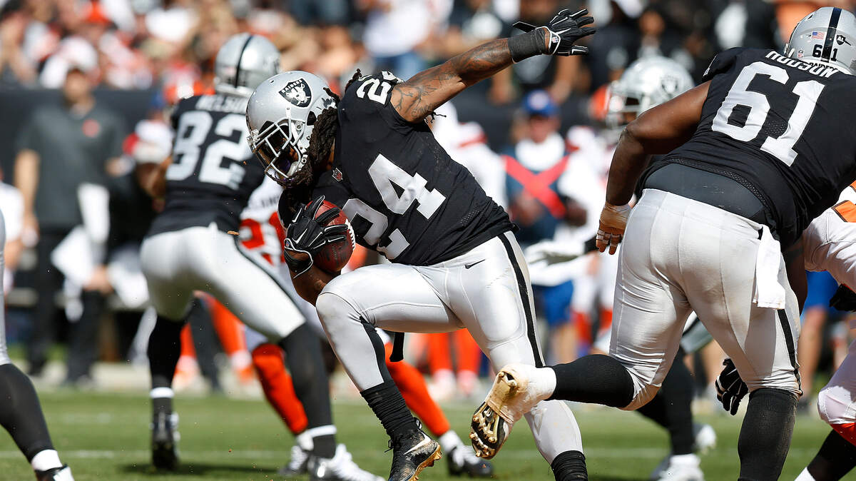 Oakland Raiders running back Marshawn Lynch (24) runs against the Cleveland Browns during an NFL football game in Oakland, Calif., Sunday, Sept. 30, 2018.