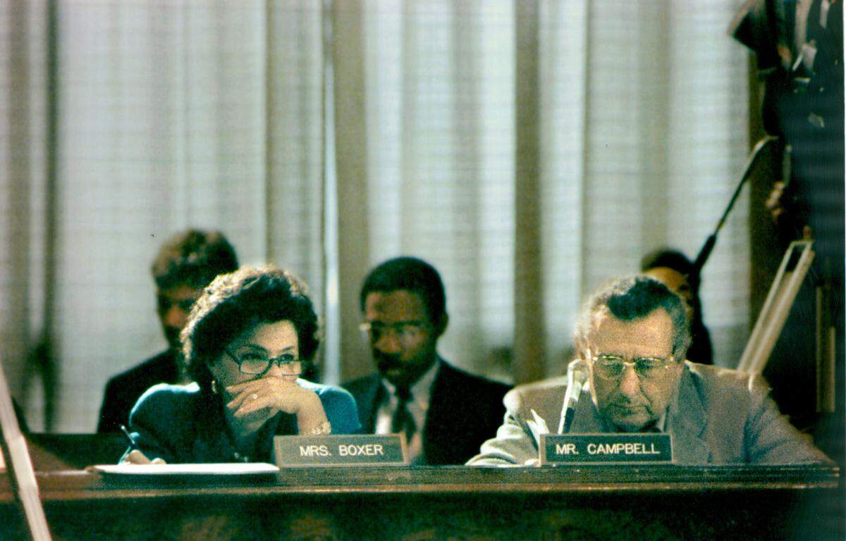 Sen/ Barbara Boxer, left, studies testimony as Sen. Ben Nighthouse Campbell, of Colorado, sits to her right during a Banking Committee Hearing in Washington, D.C. in 1993.