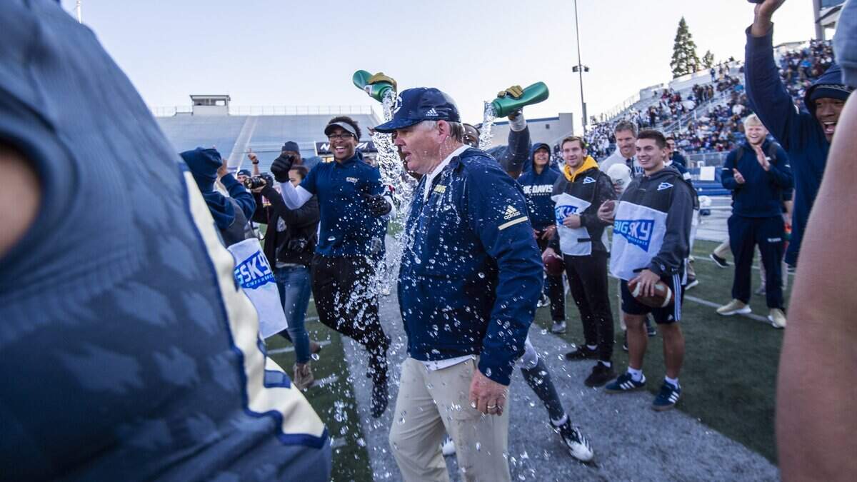 UC Davis football coach Dan Hawkins is doused after his Aggies beat Sacramento State in the 65th Causeway Classic on Nov. 17. Hawkins was honored Wednesday as the Eddie Robinson Coach of the Year, awarded annually at the Division I FCS level.