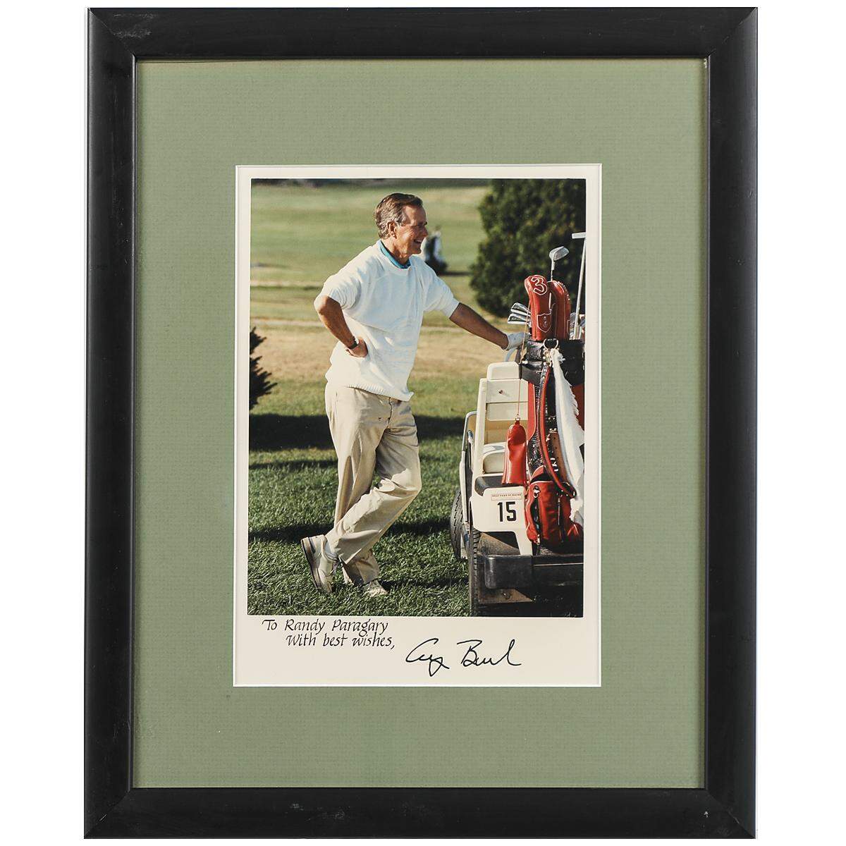 A signed photo of George Bush golfing dedicated to Randy Paragary is lot number 47 in an auction of political memorabilia from the estate of Randy Paragary.