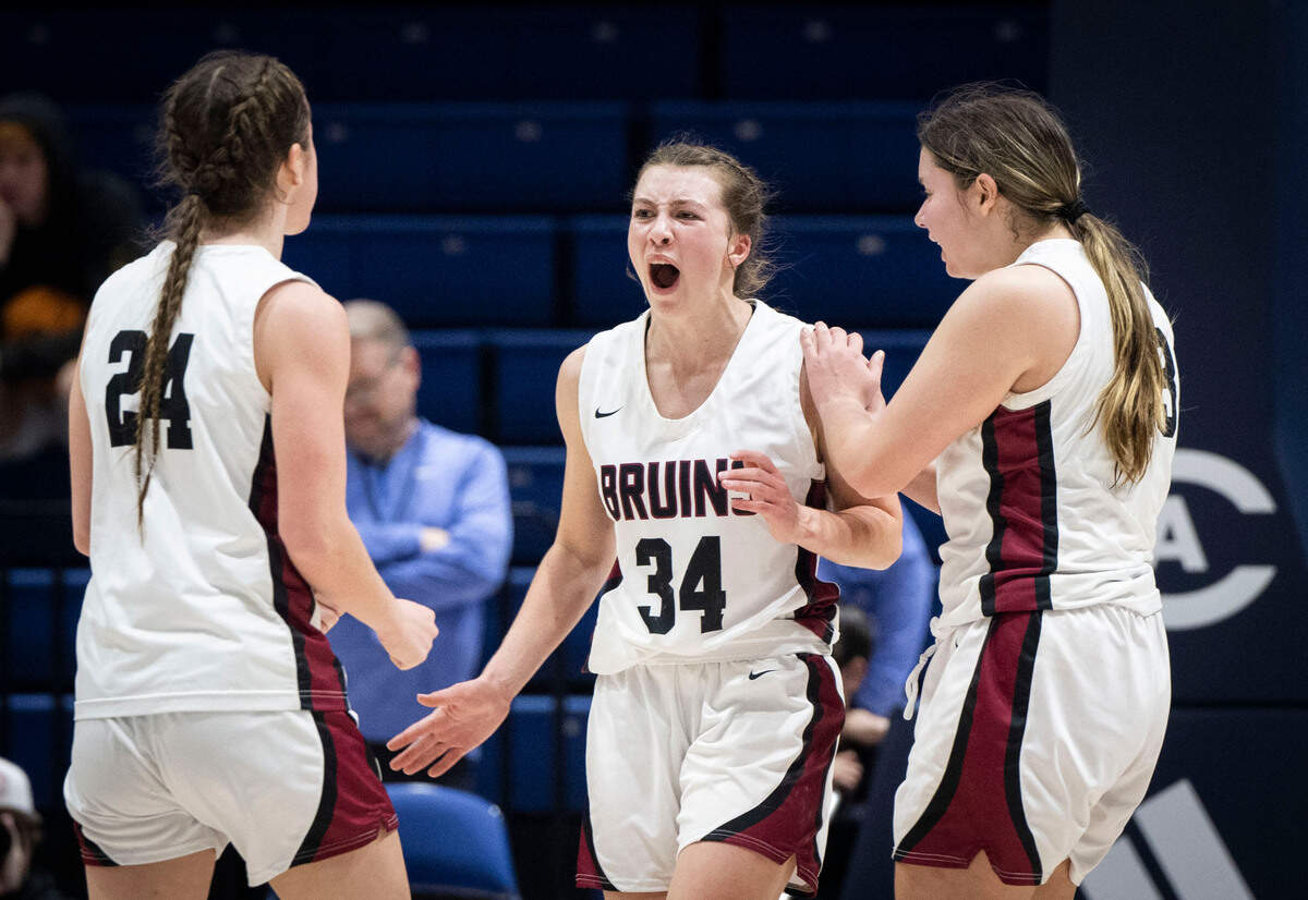 Bear River High School’s Krissy Kelly, left, Taryn Cleek, center, and Marianna Moya-Krill react as they take the lead against Valley Christian Academy during the CIF Sac-Joaquin Section Division V girls basketball section championship game on Friday at UC Davis.