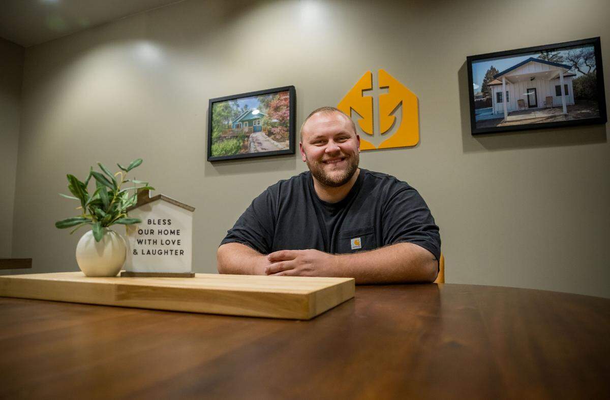 Colton Paulhus, co-founder and CEO of Anchored Tiny Homes, is sits in his Fair Oaks office on July 13, 2023. The company, opened in 2019 with his father Scott and brother Austin, builds ADUs — accessory dwelling units — across Northern California.