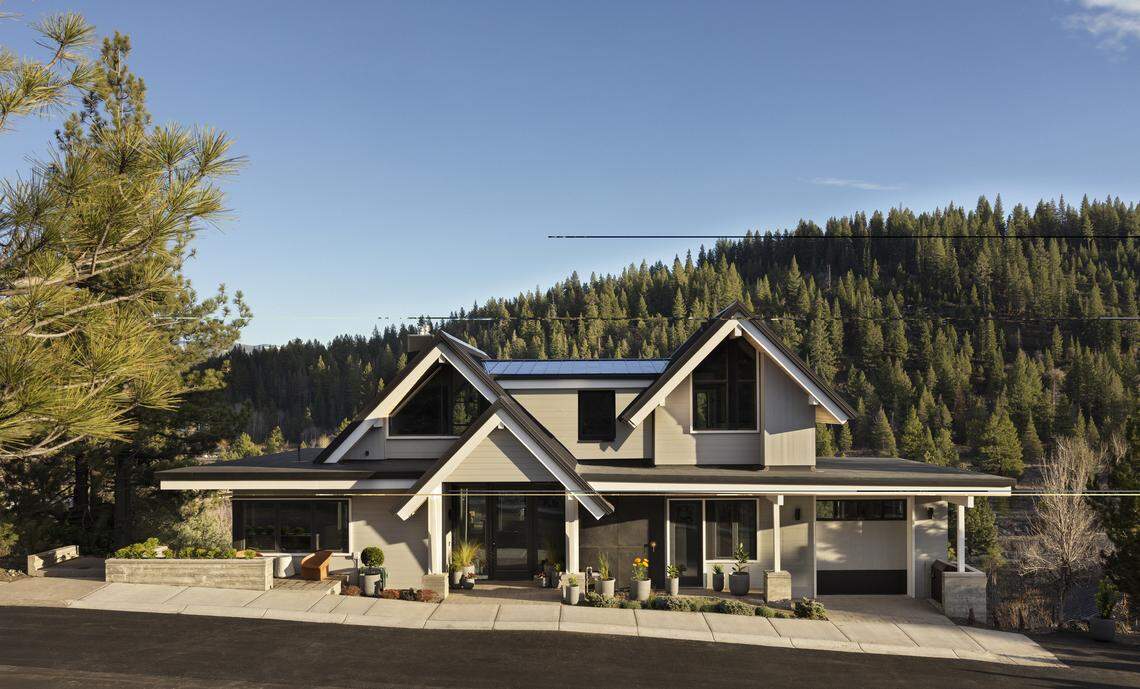 Guesthouse Lake Tahoe features a 4,000-square-foot main residence in Truckee. The home has four bedrooms — three king suites — five and a half bathrooms, three large decks with mountain views, and a series of stylish living and gathering spaces.