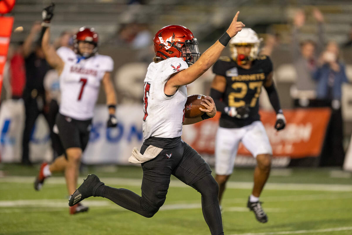 Eastern Washington Eagles QB Jared Taylor (15) celebrates as he runs for a touchdown in the fourth quarter against the Sacramento State Hornets on Saturday at Hornet Stadium.