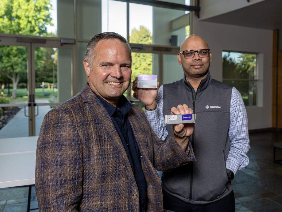 Greg Matson, left, head of products and marketing for Solidigm, and Lawrence Franklyn, right, Solidigm's chief information officer, pose for a portrait at Solidigm's offices in Rancho Cordova on Tuesday.