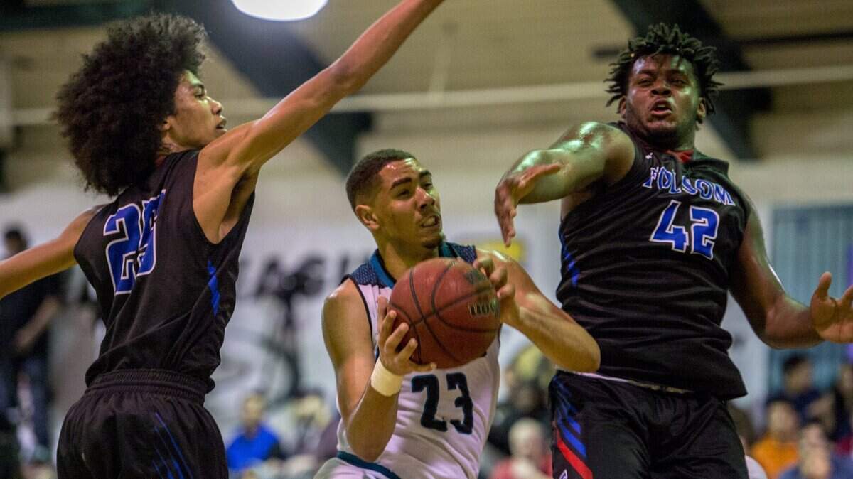After earning a Bee All-Metro honor for Folsom’s CIF State Division 1-AA champion football team, DeShawn Lynch (42), shown in a game against Sheldon last season, is averaging 13.4 points for the basketball team.
