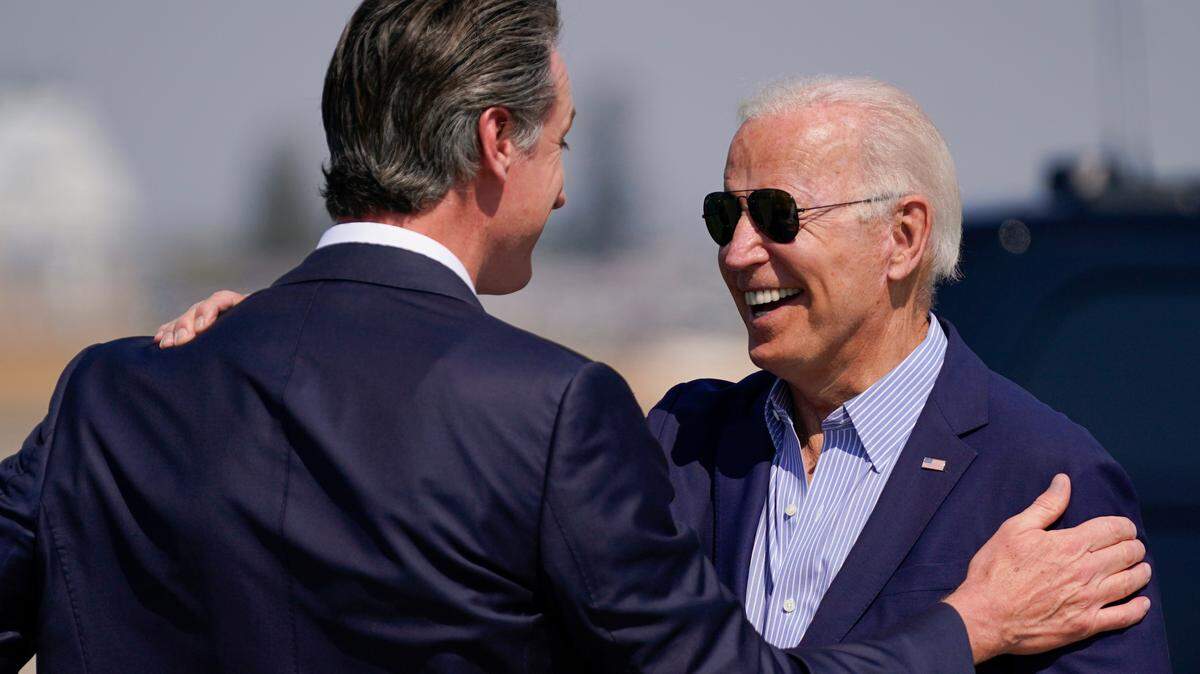 President Joe Biden talks with California Gov. Gavin Newsom as he arrives at Mather Airport on Air Force One Monday, Sept. 13, 2021, in Mather, Calif., for a briefing on wildfires at the California Governor’s Office of Emergency Services. (AP Photo/Evan Vucci)