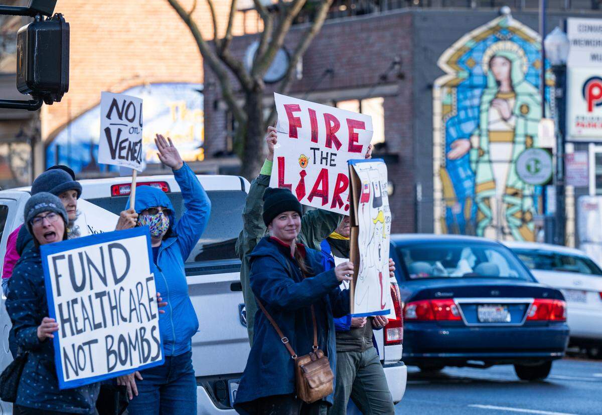Protesters demonstrate in Sacramento on Saturday against U.S. military action in Venezuela.