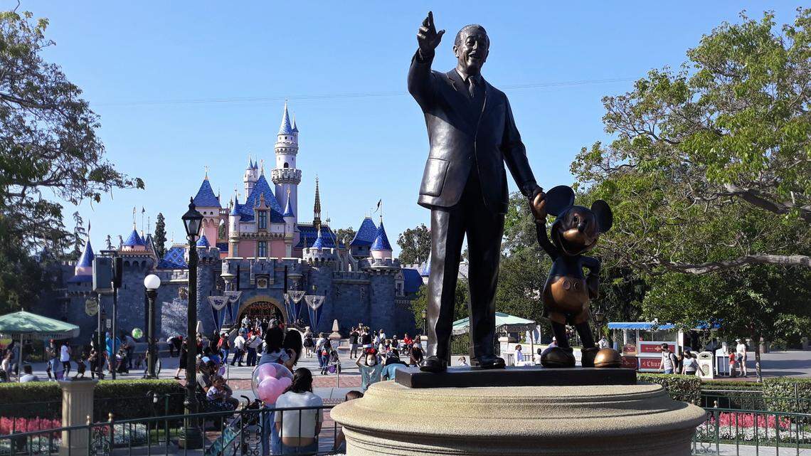 Alcohol sales at Disneyland, once banned, will expand to three restaurants, officials say. Some fans are unhappy with the change.
