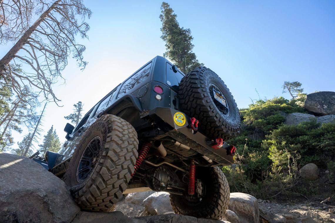 A Jeep drives over boulders on the Rubicon Trail as part of the Jeep Jamboree in El Dorado County on June 11.