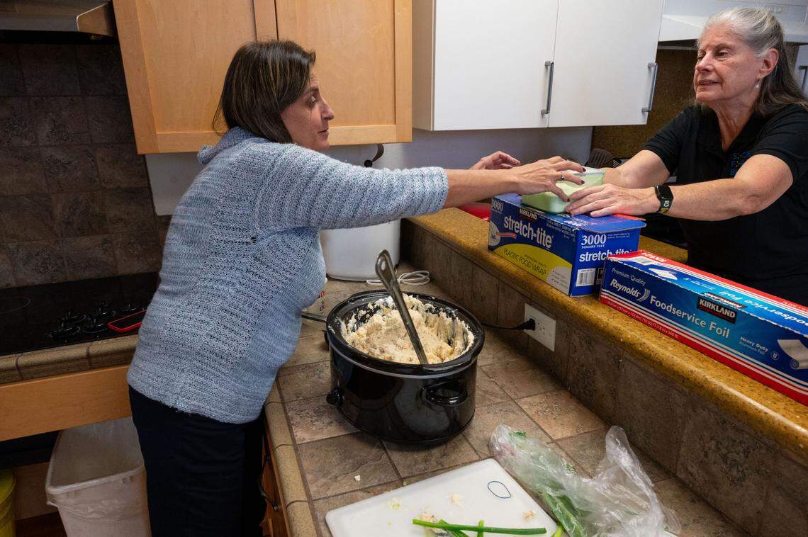 Jill Guilbeau and Diane Starin, instructors at Society for the Blind, prepare for their holiday potluck in the instructional kitchen, Nov. 25. The Society for the Blind is asking Book of Dreams readers for help to upgrade its training kitchen.