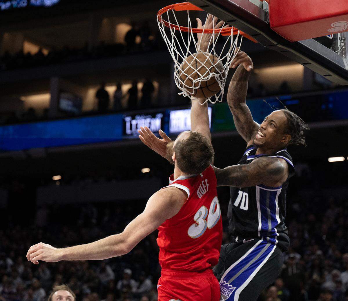 Sacramento Kings forward DeMar DeRozan (10) scores over Memphis Grizzlies center Jay Huff (30) in January.