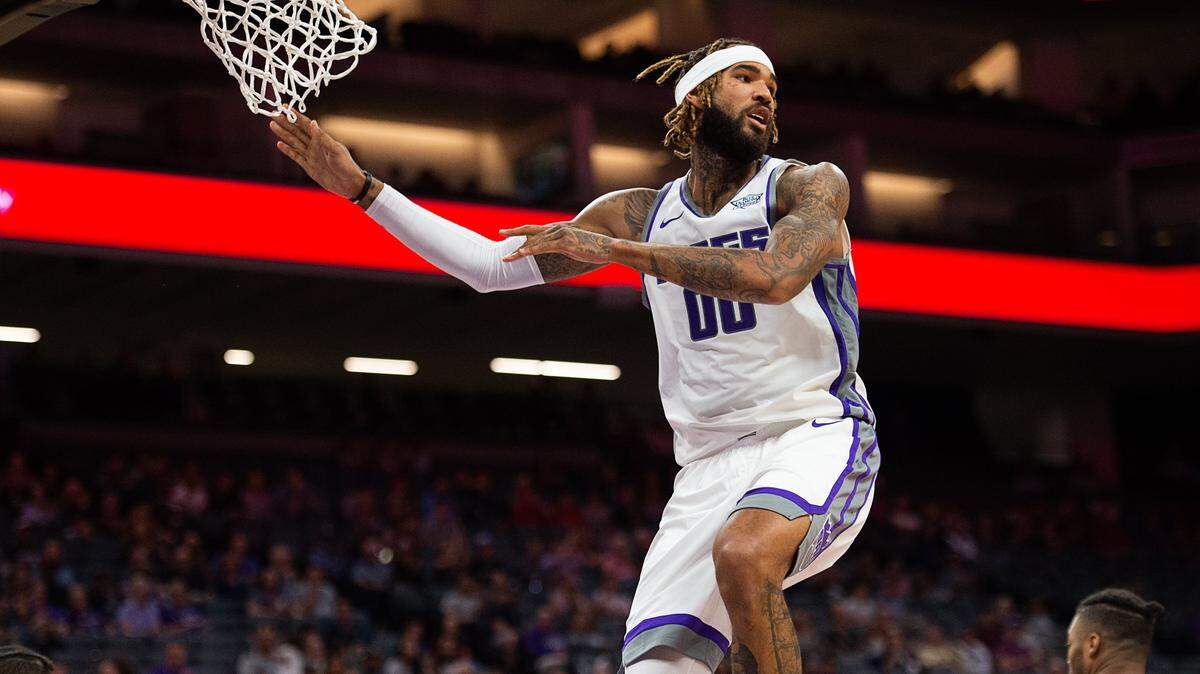 Kings center Willie Cauley-Stein (00) descends after dunking during a preseason game against Maccabi Haifa at Golden 1 Center on Monday, Oct. 8, in Sacramento.