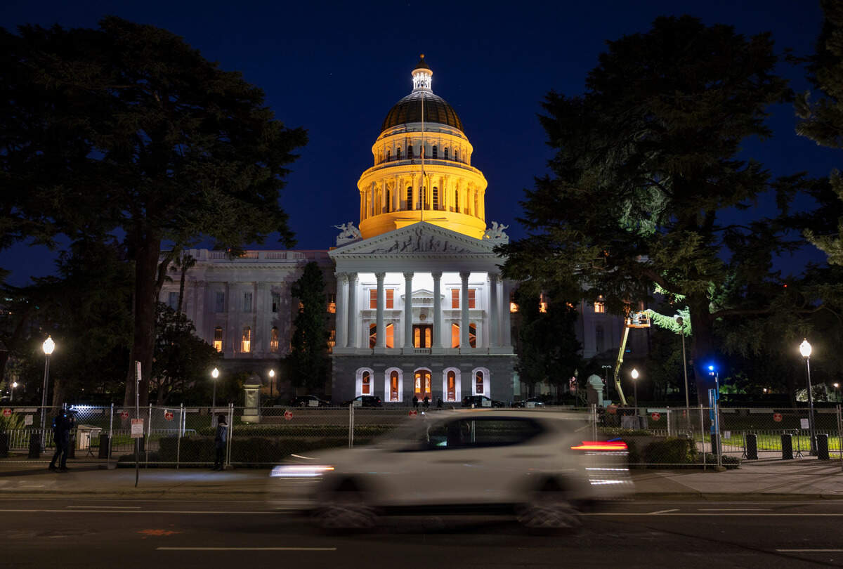 16. The California Capitol is tinted with an amber glow on Tuesday night, Jan. 19, 2021, as part of a nationwide remembrance of lives lost to COVID-19.