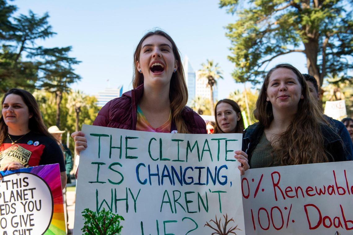 UC Davis students, Ruby Teller, 19, center, and Hannah Squire, 18, right, join other young activists to protest the government’s failure to take action to stop climate change, Friday, March 15, 2019 at the State Capitol in Sacramento.