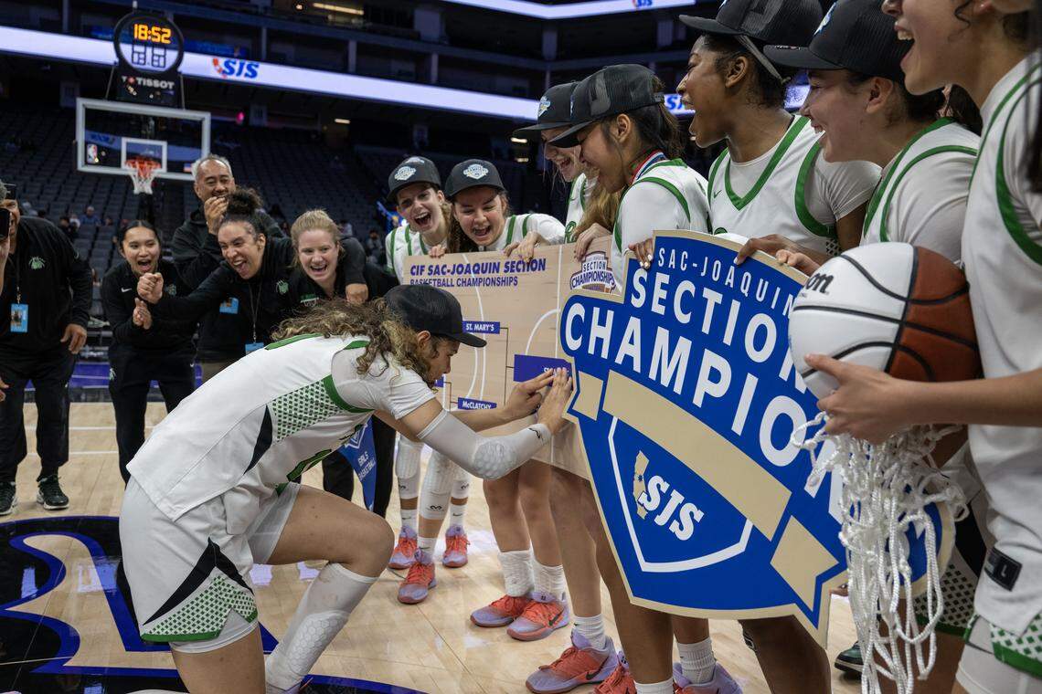 The St. Mary's Rams’ Evelini Smith adds the Rams name in the winners bracket following their victory over the McClatchy Lions in the CIF Sac-Joaquin Section Division I championship game Saturday at Golden 1 Center.