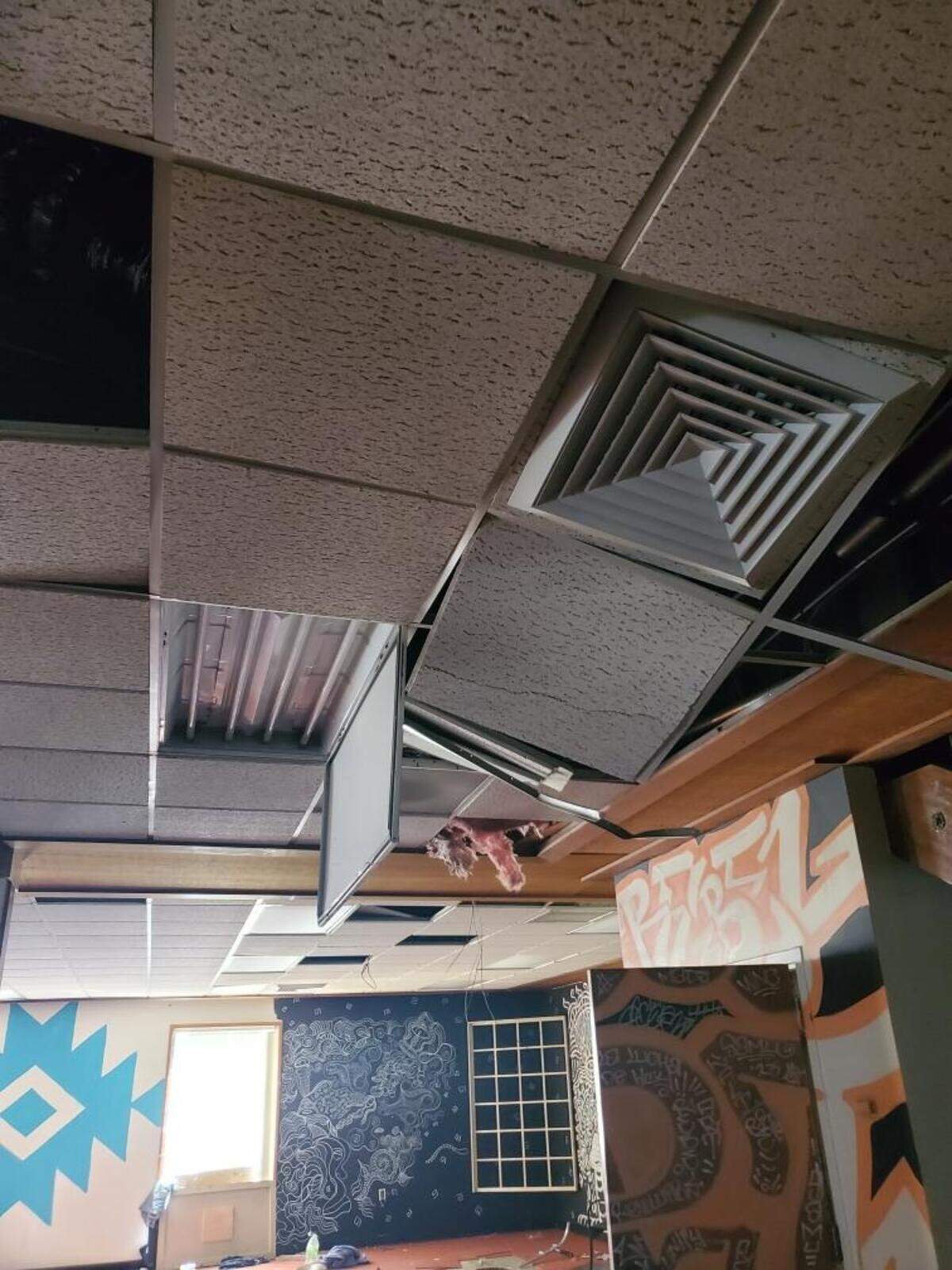 Tiles dangle from the ceiling of UniverSoul Cafe after burglars struck on Saturday, July 12, 2025, halting food recovery efforts and dealing a setback to the Del Paso nonprofit.