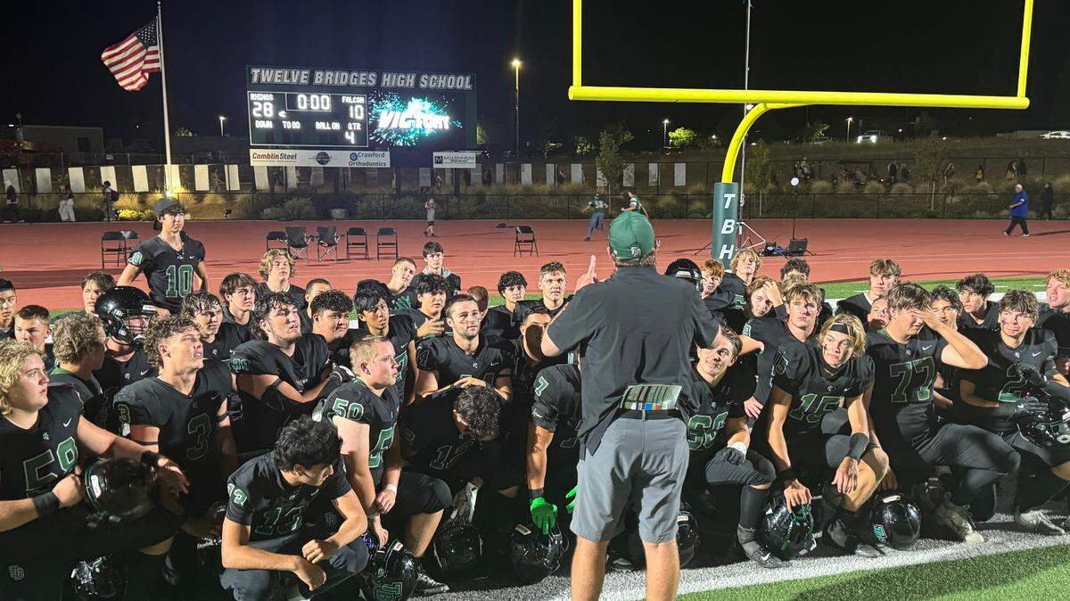 Twelve Bridges players and coaches meet following their 28-10 win over Christian Brothers on Friday, Aug. 24, 2024, at Twelves Bridges High School in Lincoln.