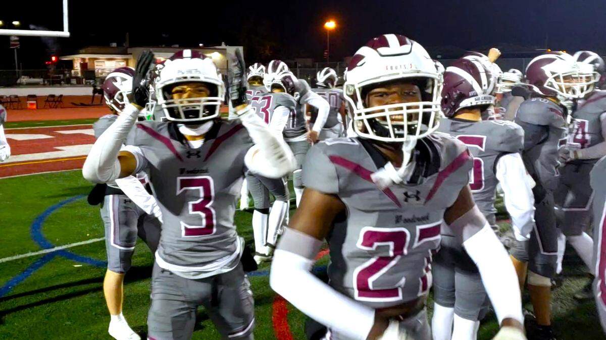 Woodcreek’s Elijah Taylor (3) and Jerry Whyte (27) celebrate after a 56-33 win over Armijo Friday night in a Sac-Joaquin Section Division III playoff opener. 