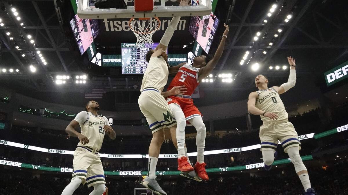 Milwaukee Bucks’ Brook Lopez blocks a shot by Sacramento Kings’ De’Aaron Fox during the first half of an NBA basketball game Monday, Feb. 10, 2020, in Milwaukee. (AP Photo/Morry Gash)