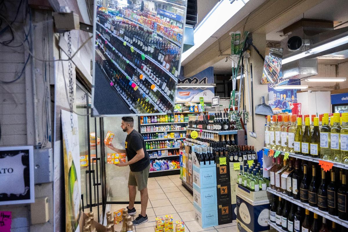 Preet Singh, 33, owner of Pacific Market on P Street in midtown Sacramento works at his store on Wednesday, Oct. 12. Singh, a self proclaimed beer connoisseur, said he has a large selection of local beer on his shelves.