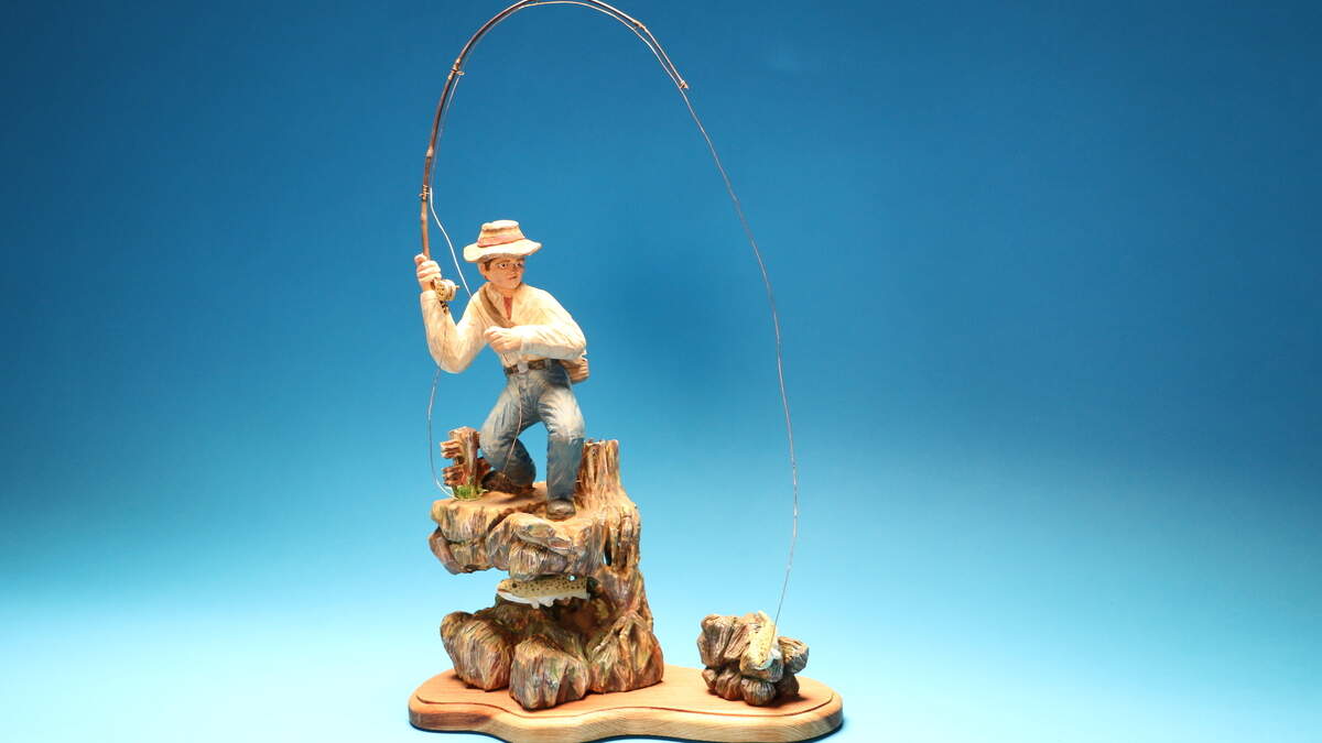 Artists at the Capital Woodcarvers Association produce pieces of art like this fishing piece.