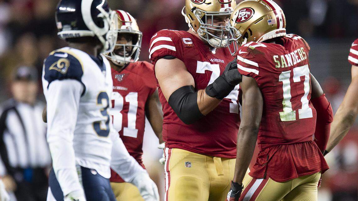 San Francisco 49ers offensive tackle Joe Staley (74) congratulates San Francisco 49ers wide receiver Emmanuel Sanders (17) after his pass reception to set up the winning field goal in the fourth quarter agains the Los Angeles Rams during a game at Levi’s Stadium on Saturday, December 21, 2019 in Santa Clara, Calif.