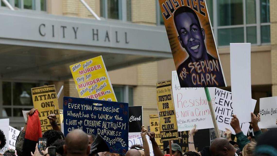 Protesters demanding the indictment of two Sacramento police officers who killed Stephon Clark walk by Sacramento City Hall on April 4. Clark, who was unarmed, was shot on March 18.