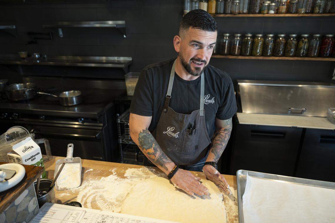 Owner Chris Barnum-Dann makes biscuits in preparation for Localis’s return of brunch service at their restaurant in Sacramento on Sunday, Feb. 22, 2026.