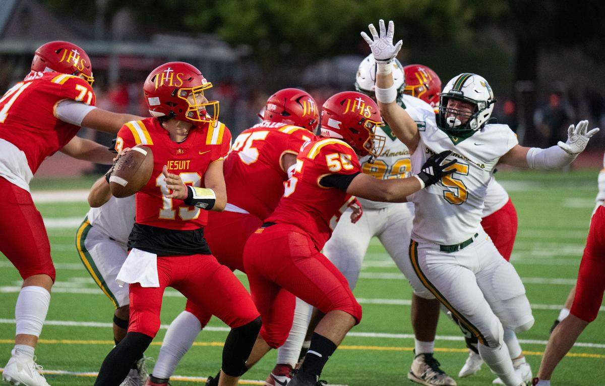 The Jesuit Marauders’ Teddy Rios (13) looks to pass against Rio Americano in 2024.
