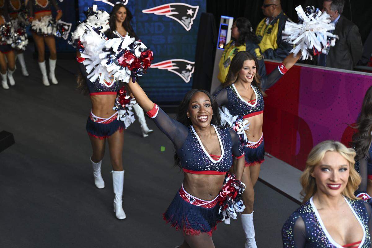 Patriots cheerleaders walk onto the field before the start of Super Bowl LX at Levi’s Stadium in Santa Clara on Sunday, Feb. 8, 2026.