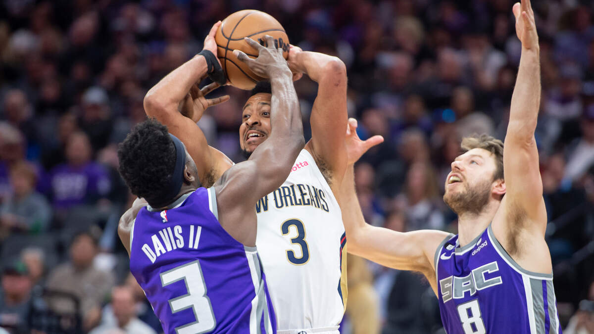 Sacramento Kings guard Terence Davis (3) and guard Matthew Dellavedova (8) put pressure on New Orleans Pelicans guard CJ McCollum (3) in the first half of the NBA basketball game Monday, March 6, 2023, at Golden 1 Center in Sacramento.
