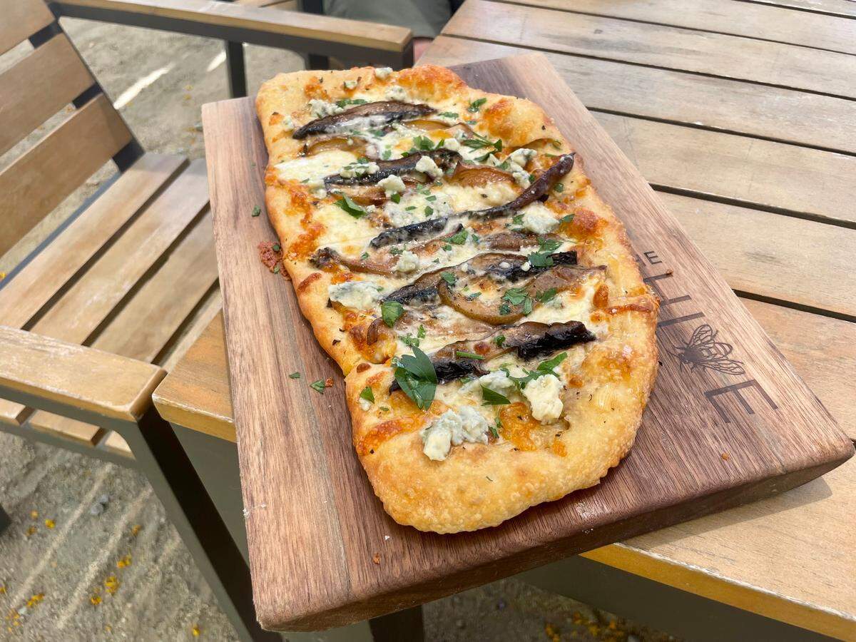 The Hive’s Napoletano flatbread comes with roasted pear, portobello mushrooms, Gorgonzola cheese and housemade honey.