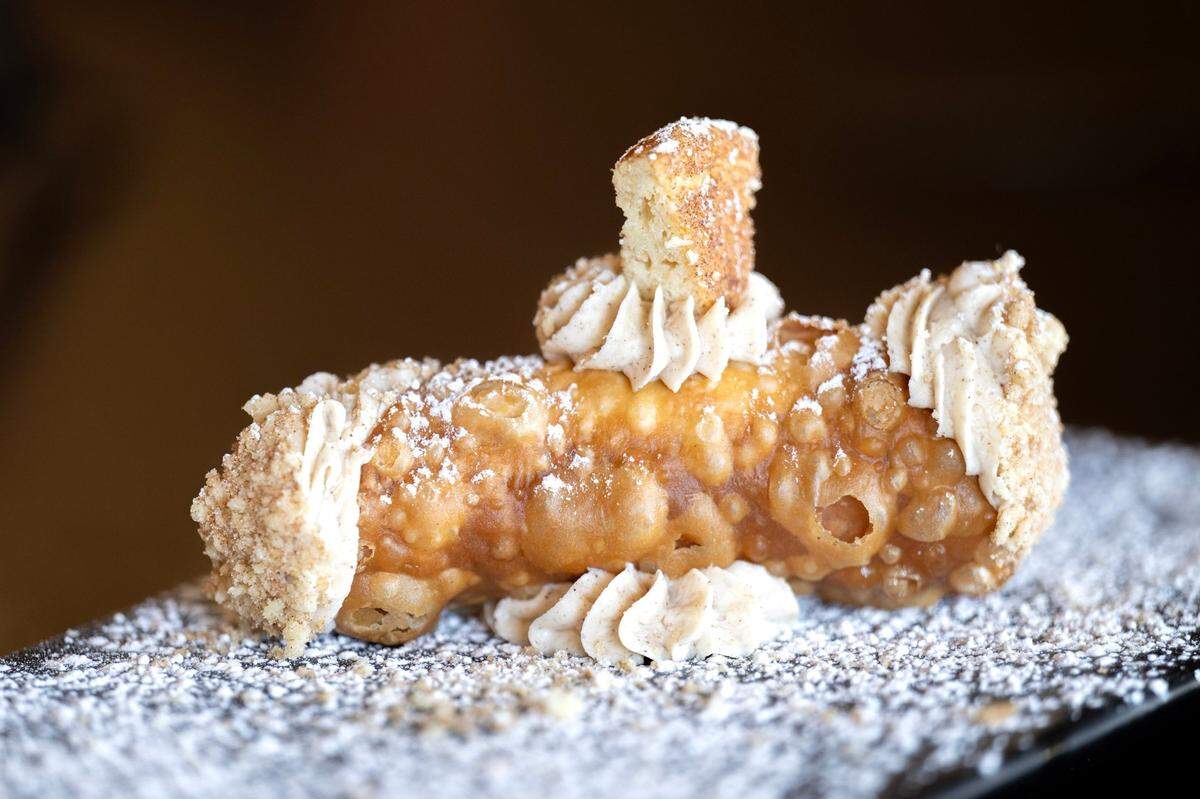The caramel cannoli ($6) is ready to serve at Ippolito’s Trattoria in Rosemont. It features a fried pasty shell filled with creamy ricotta and cinnamon, topped with caramel and powdered sugar.