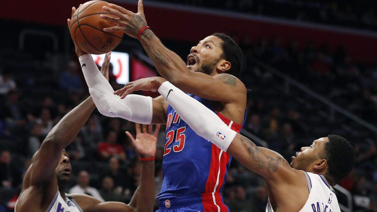 RETRANSMISSION TO CORRECT PLAYER AT RIGHT TO KENT BAZEMORE - Detroit Pistons guard Derrick Rose (25) attempts a layup as Sacramento Kings center Kent Bazemore, right, and forward Anthony Tolliver (43) defend during the first half of an NBA basketball game, Wednesday, Jan. 22, 2020, in Detroit. (AP Photo/Carlos Osorio)