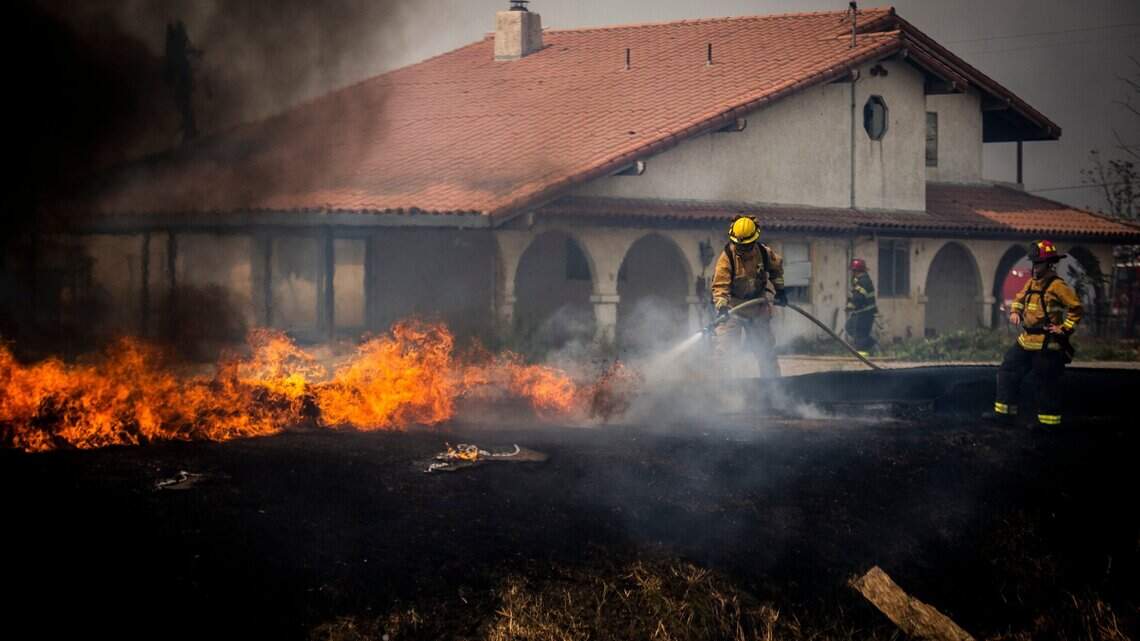 Wind-swept fire is contained near Sacramento airport. Interstate 5 has been reopened