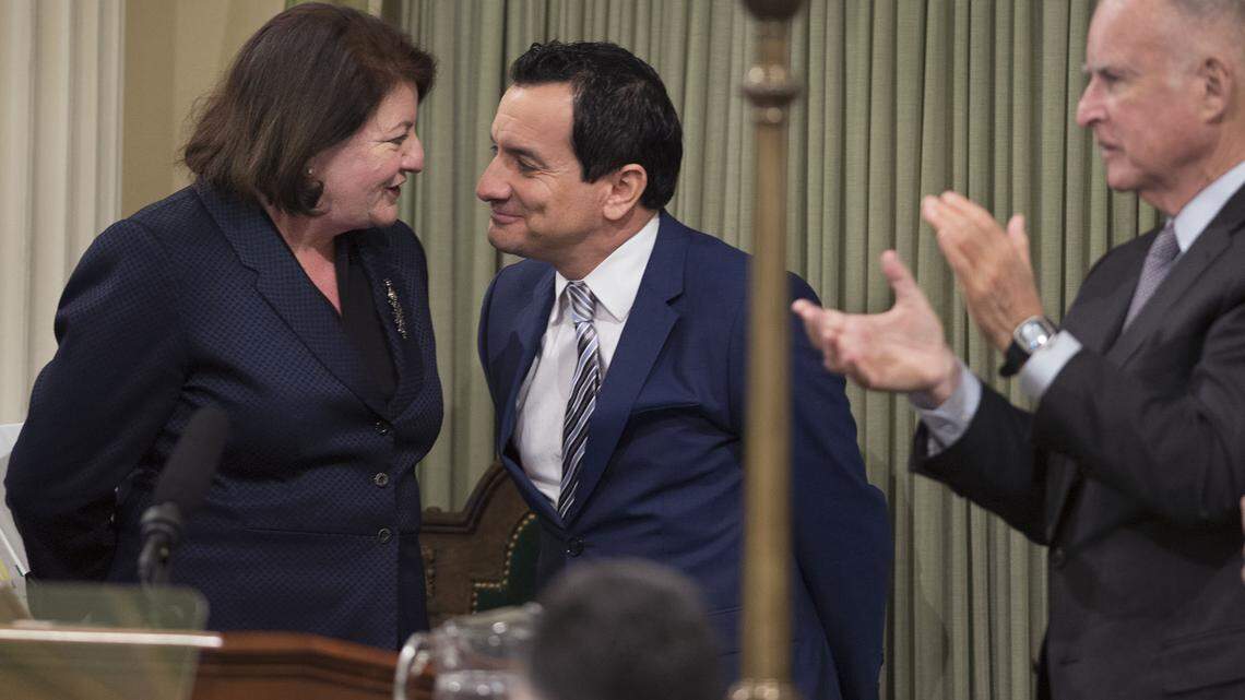 In this March 2016 file photo, newly-sworn Speaker of the California State Assembly Anthony Rendon smiles at outgoing speaker Toni Atkins, while Gov. Jerry Brown claps. Atkins was elected to the state Senate in 2016 and named Senate President pro tempore in 2018. Both are looking at runs for statewide office in 2026.