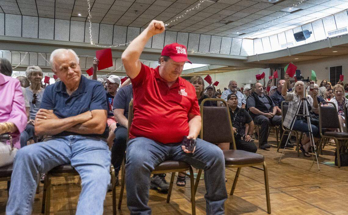 Mike Ariza, of Chico, raises his fist in support of Rep. Doug LaMalfa, R-Oroville, during a town hall meeting on Monday in Chico. "It needs to be a lot more civil," Ariza said after the event. "I know they don’t like his answers but they need to let him talk."