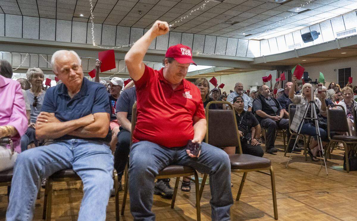 Mike Ariza, of Chico, raises his fist in support of Rep. Doug LaMalfa, R-Oroville, during a town hall meeting on Monday, Aug. 11, 2025, in Chico. "It needs to be a lot more civil," Ariza said after the event. "I know they don’t like his answers but they need to let him talk."