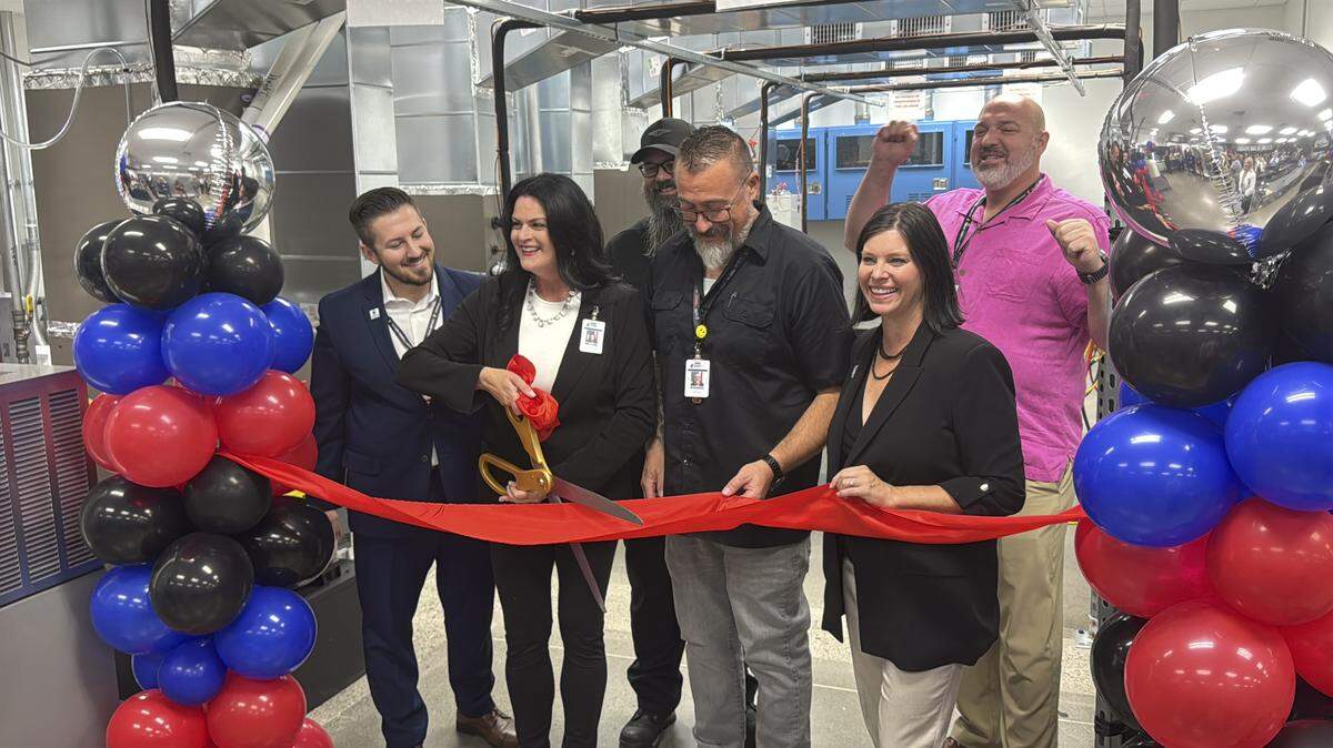 Universal Technical Institute Sacramento leaders, including President Tess Kraiker, second from left, are joined by Sacramento City Councilmember Lisa Kaplan, right, for the opening of UTI’s HVACR lab in Natomas on Aug. 8, 2025. At the HVACR lab, students will train on walk-in coolers, commercial equipment, and residential systems, to prepare themselves for high-demand trade jobs.
