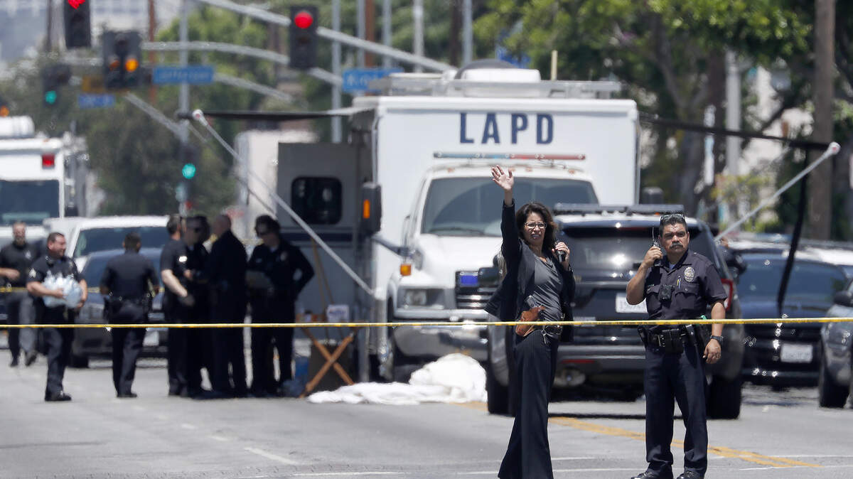 Police set up a command post at the scene of an officer-involved shooting in south Los Angeles on Aug. 7.