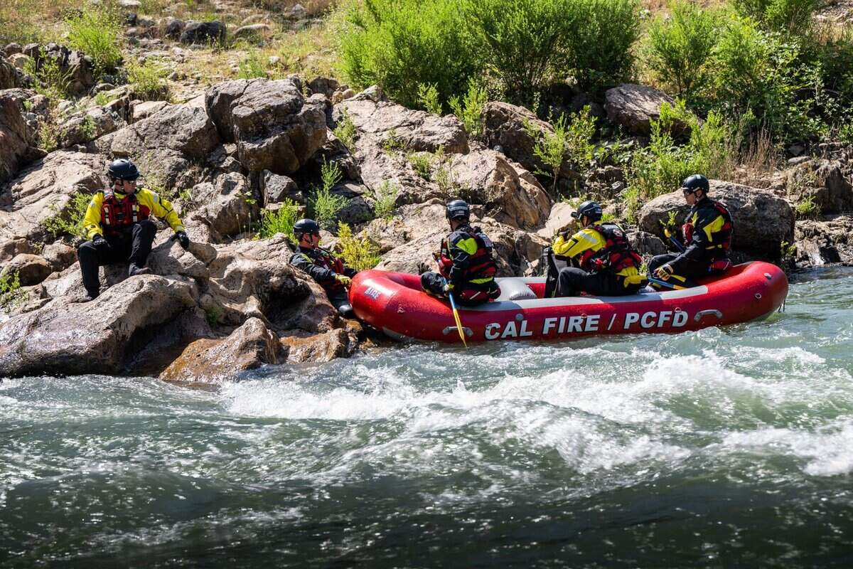 First responders from the Placer County Sheriff’s Office, Cal Fire and California State Parks demonstrate the challenge rescues on swiftly running water at the confluence of north and middle forks of the American River near Auburn on Wednesday. One person has died, and another remains missing, in the American River in Placer County in recent weeks.