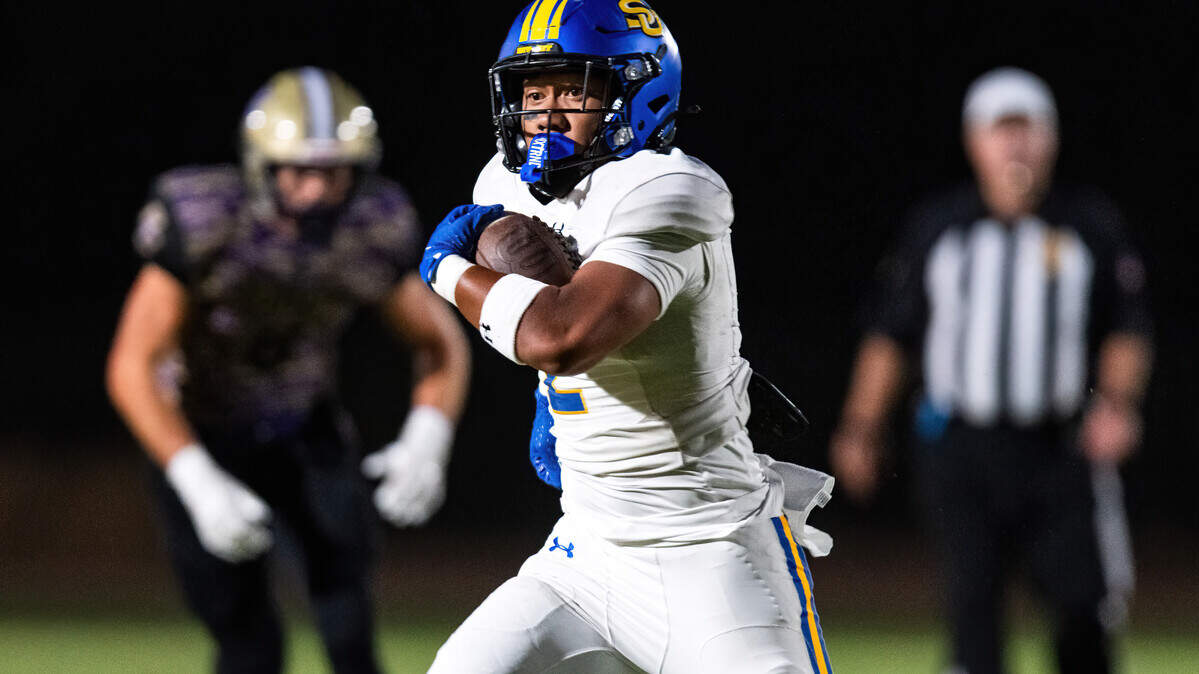 The Sutter Huskies' Losi Asiata (2) sprints for a long touchdown in the first quarter against the Bradshaw Christian Pride in Vineyard on Friday.