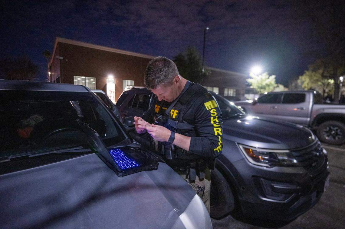 Sacramento Sheriff’s deputy Eilers begins the booking process after arresting a man who propositioned a female deputy posing as a prostitute on Watt Avenue in North Highlands on Friday.