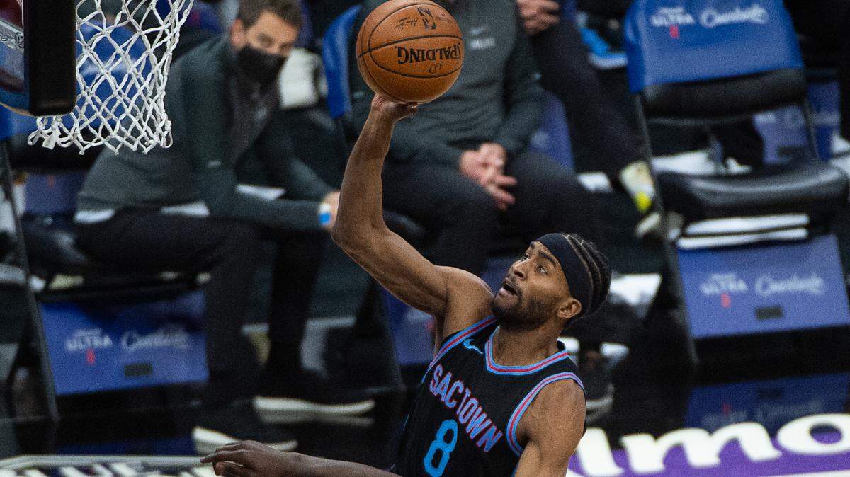 Sacramento Kings forward Maurice Harkless (8) is folded by Dallas Mavericks forward Dorian Finney-Smith (10) in the fourth quarter during a game at Golden 1 Center on Monday, April 26, 2021 in Sacramento.The KIngs beat the Mavericks 113-106.