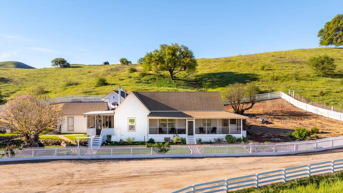 Anchored by a 2,368-square-foot main residence and a caretaker’s home, the working headquarters features classic agricultural infrastructure, including barns, livestock corrals, and outbuildings.