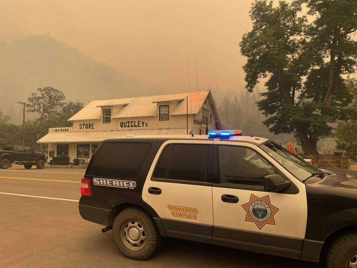 A Siskiyou County Sheriff’s Office patrol vehicle is seen outside of Quigley’s General Store in Klamath River, Calif., on Saturday, July 30, 2022. The McKinney Fire, which sparked Friday afternoon, has burned more than 30,000 acres and prompted evacuations of more than 2,000 residents west of Yreka.